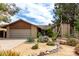 Single-story home featuring desert landscaping, a two-car garage and a paved driveway at 4839 E Marilyn Rd, Scottsdale, AZ 85254