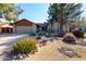 Charming single-Gathering home features brick accents and a well-manicured desert landscape with colorful plants at 4839 E Marilyn Rd, Scottsdale, AZ 85254