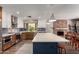 Well-appointed kitchen featuring stainless steel appliances, a large island, and ample counter space at 4839 E Marilyn Rd, Scottsdale, AZ 85254