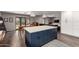Open-concept kitchen with large center island and open views to the dining and living spaces at 4839 E Marilyn Rd, Scottsdale, AZ 85254