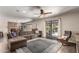 Living room with hardwood floors, a ceiling fan, and a large sectional sofa at 4839 E Marilyn Rd, Scottsdale, AZ 85254