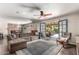 Spacious living room boasts hardwood floors, a ceiling fan, and access to the outdoor pool at 4839 E Marilyn Rd, Scottsdale, AZ 85254