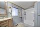Full bathroom featuring light blue walls, sink with vanity, window with curtain and shower and tub combo at 5524 E Harmon Cir, Mesa, AZ 85215