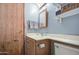 Clean bathroom featuring a vanity with storage and convenient toilet placement at 5524 E Harmon Cir, Mesa, AZ 85215