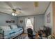 Functional bedroom including a desk area, window, and soft natural lighting at 5524 E Harmon Cir, Mesa, AZ 85215