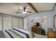 Bedroom with light blue walls, carpeted floors, white closet doors, wood trim, TV on bureau at 5524 E Harmon Cir, Mesa, AZ 85215