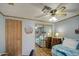 Well-organized bedroom featuring a mirrored closet and soft natural lighting at 5524 E Harmon Cir, Mesa, AZ 85215