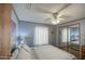 Comfortable bedroom featuring a plush bed, mirrored closet, and soft natural lighting at 5524 E Harmon Cir, Mesa, AZ 85215