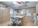 Spacious kitchen featuring an island with seating and ample cabinet space for storage at 5524 E Harmon Cir, Mesa, AZ 85215