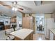 Open-concept living space leading to a kitchen with ample cabinetry and an adjacent dining area at 5524 E Harmon Cir, Mesa, AZ 85215