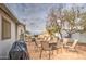 Relaxing paved patio with comfortable chairs, side tables, grill, and a tranquil outdoor space at 5524 E Harmon Cir, Mesa, AZ 85215