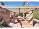 Cozy backyard with a brick seating area, pergola, and hammock, ideal for outdoor relaxation and entertainment at 6320 N 4Th Pl, Phoenix, AZ 85012