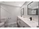 Modern bathroom with double sinks, quartz counters, and black hardware at 6320 N 4Th Pl, Phoenix, AZ 85012