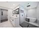Bathroom with a modern walk-in shower, soaking tub, double vanity and sleek black accents at 6320 N 4Th Pl, Phoenix, AZ 85012