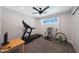 Bright exercise room with carpet, a ceiling fan and window overlooking the neighborhood at 6320 N 4Th Pl, Phoenix, AZ 85012