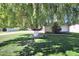 Lush front yard featuring a mature tree with shade and a well-maintained lawn at 6320 N 4Th Pl, Phoenix, AZ 85012