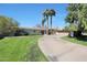 Charming single-story home featuring mature landscaping, a circular driveway, and a well-manicured lawn at 6320 N 4Th Pl, Phoenix, AZ 85012