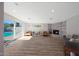 Spacious living room with brick fireplace and sliding glass doors to backyard pool at 6320 N 4Th Pl, Phoenix, AZ 85012