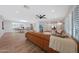 Cozy living room with leather sofa, ceiling fan, plantation shutters, and open layout at 6320 N 4Th Pl, Phoenix, AZ 85012