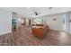 Bright living room with hardwood floors, comfortable seating, and sliding barn door to office at 6320 N 4Th Pl, Phoenix, AZ 85012