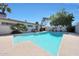 Gorgeous backyard pool with a serene sitting area and views of the surrounding trees at 6320 N 4Th Pl, Phoenix, AZ 85012