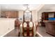 Elegant dining room with wood floors, ornate table and chairs, and natural light at 6822 W Alta Vista Rd, Laveen, AZ 85339