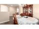 Inviting dining area features a traditional table setting and a charming china cabinet at 6822 W Alta Vista Rd, Laveen, AZ 85339