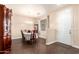 Traditional dining room features hardwood floors, chandelier, table, and a large china cabinet at 6822 W Alta Vista Rd, Laveen, AZ 85339