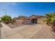 Well-kept single-Gathering home boasting a xeriscaped front yard and a spacious two-car driveway at 6822 W Alta Vista Rd, Laveen, AZ 85339