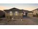 Charming single-story home featuring a well-maintained front yard and neutral-toned exterior at 6822 W Alta Vista Rd, Laveen, AZ 85339