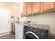 Laundry room featuring washer, dryer, upper cabinets and counter space at 6822 W Alta Vista Rd, Laveen, AZ 85339
