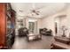 Cozy living room with hardwood floors, ceiling fan, and plush seating at 6822 W Alta Vista Rd, Laveen, AZ 85339