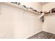 Wood-look floors and shelving provide ample storage in this walk-in closet at 6822 W Alta Vista Rd, Laveen, AZ 85339