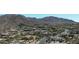 Aerial view of a community nestled in the mountains at 7013 E Summit Trail Cir, Mesa, AZ 85207