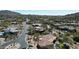 Expansive aerial view of a luxury desert community with beautiful homes and desert landscaping at 7013 E Summit Trail Cir, Mesa, AZ 85207