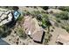 Expansive estate with a tile roof, lush landscaping, large pool with a spa, and beautiful grounds at 7013 E Summit Trail Cir, Mesa, AZ 85207