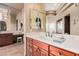 Elegant bathroom boasting a marble countertop, recessed lighting, and decorative mirrors at 7013 E Summit Trail Cir, Mesa, AZ 85207