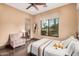 Inviting bedroom with a large window showcasing the desert landscape at 7013 E Summit Trail Cir, Mesa, AZ 85207