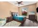 Comfortable bedroom featuring a stylish bed, dark furniture, and bright accents at 7013 E Summit Trail Cir, Mesa, AZ 85207