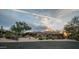 Stunning desert home boasting a three-car garage and beautifully xeriscaped front yard at 7013 E Summit Trail Cir, Mesa, AZ 85207