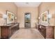 Elegant foyer featuring decorative art pieces and stylish console tables at 7013 E Summit Trail Cir, Mesa, AZ 85207