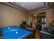 Entertainment room featuring a billiard table, recessed lighting, and classic trim work at 7013 E Summit Trail Cir, Mesa, AZ 85207