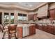 Spacious kitchen with modern appliances, granite countertops, and custom wood cabinetry at 7013 E Summit Trail Cir, Mesa, AZ 85207