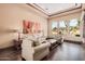 Cozy living room with large windows offering scenic outdoor views at 7013 E Summit Trail Cir, Mesa, AZ 85207