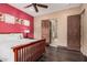 Comfortable bedroom featuring a wooden bed frame and an en-suite bathroom at 7013 E Summit Trail Cir, Mesa, AZ 85207