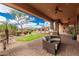 Outdoor patio with views of the desert landscape, built in BBQ and comfortable seating at 7013 E Summit Trail Cir, Mesa, AZ 85207