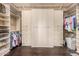 Spacious walk-in closet with custom shelving and ample storage for an organized wardrobe at 7013 E Summit Trail Cir, Mesa, AZ 85207