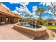 Backyard water feature with desert views and stone detailing at 7013 E Summit Trail Cir, Mesa, AZ 85207
