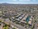 An aerial view captures the community, highlighting the local area, roadways, and local shopping at 705 W Queen Creek Rd # 1201, Chandler, AZ 85248