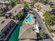 Overhead view of the community with a shimmering pool and calm waterways throughout at 705 W Queen Creek Rd # 1201, Chandler, AZ 85248